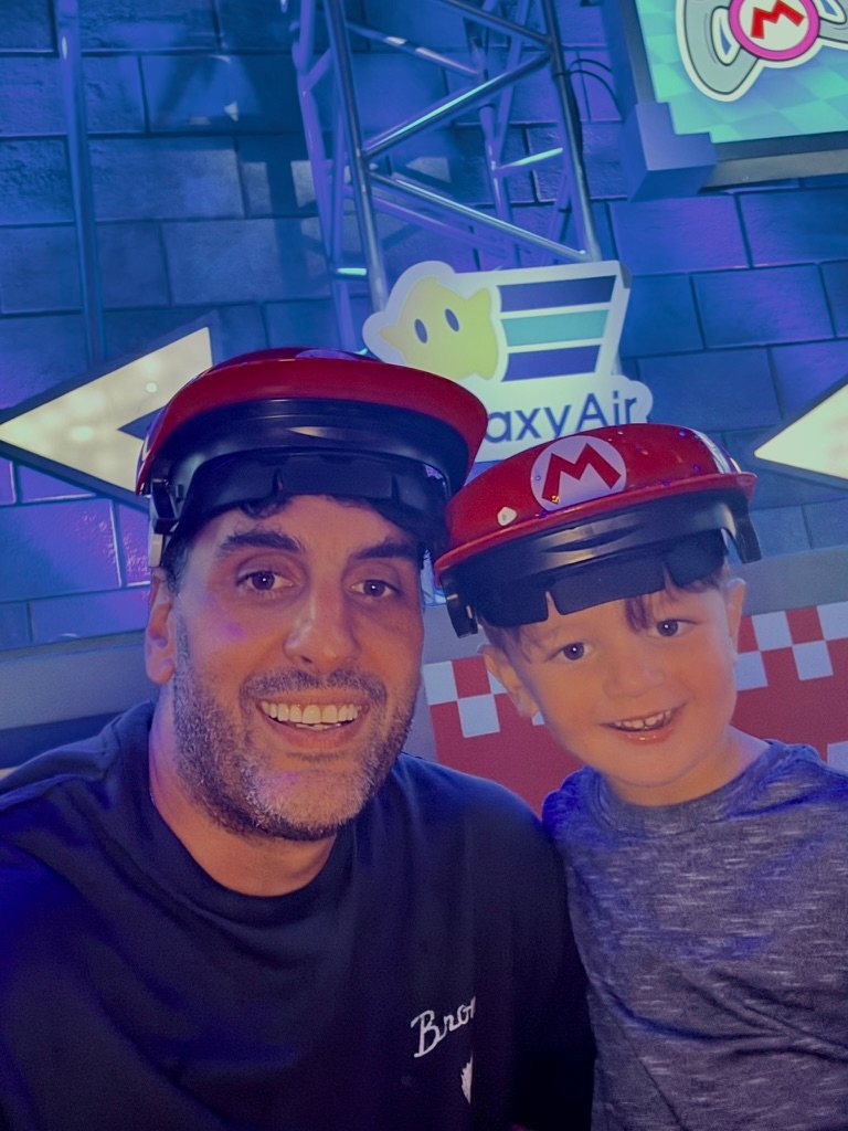 Daniel and his son wearing Mario hats
